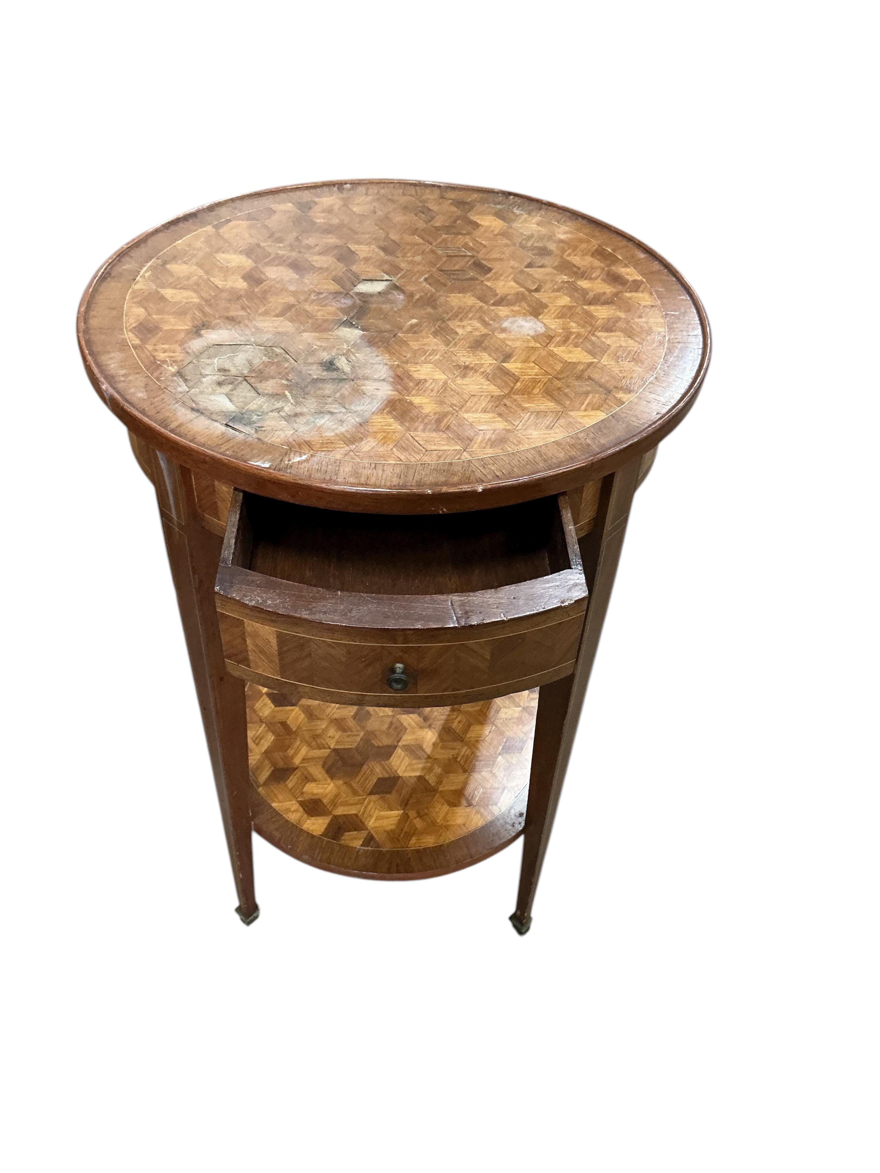 A French transitional style circular parquetry inlaid two tier table, diameter 50cm, height 75cm